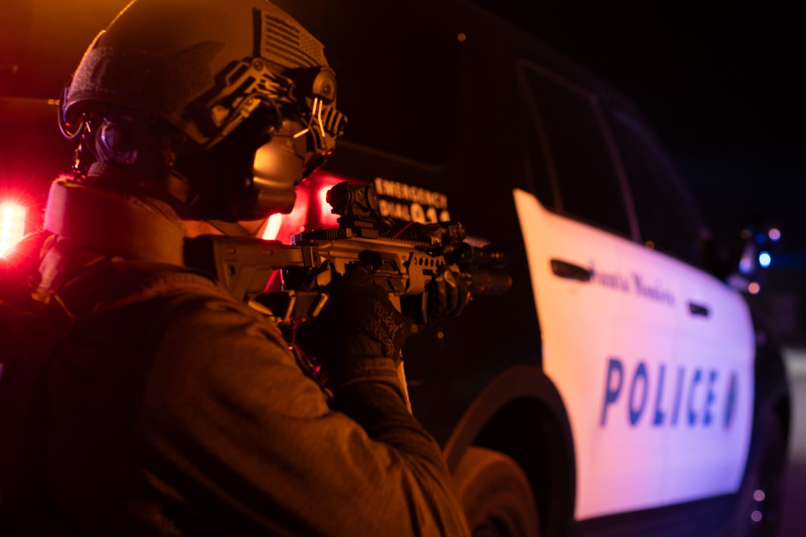 A tactical officer with a weapon